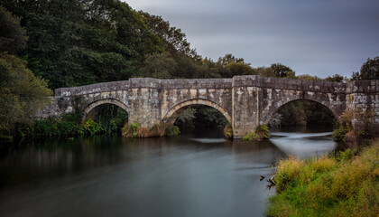 Fototapeta na wymiar 16th century Brandomil Bridge located in the town of Zas, Galicia, Spain