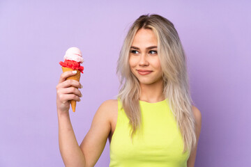 Teenager girl over isolated purple background with happy expression