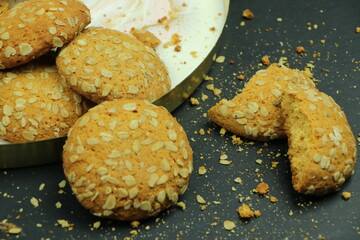  round ginger biscuit with crumbs