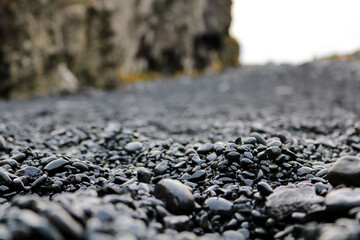 Black sand pebble beach close-up