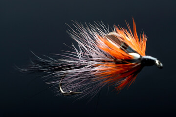 Brightly coloured hand-made fishing lure.