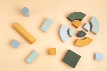 Abstact flat lay with geometric forms over beige background