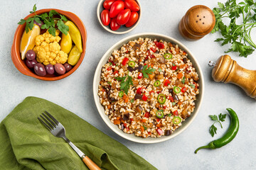 Bulgur pilaf with eggplant and vegetables. Top view