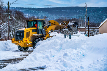 Front End Loader Cleaning Snow