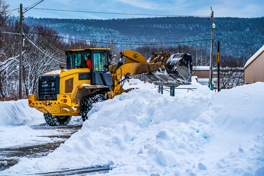 Front End Loader Cleaning Snow