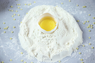 ingredients for homemade pasta. Food background: macaroni, spagetti, egg, flour