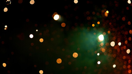Fireworks background with blurred lights on black background