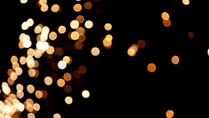 Fireworks background with blurred lights on black background