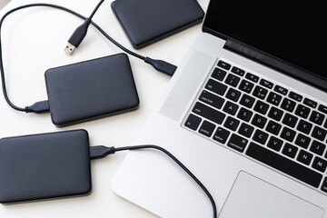 External backup disk hard drive connected to laptop