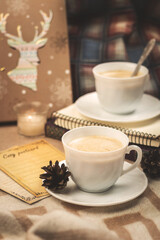 Mockup of a cozy evening in plaids, with a cup of hot drink, coffee, atmosphere and mood, vertical photo