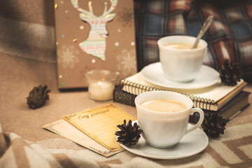 Mockup of a cozy evening in plaids, with a cup of hot drink, coffee, atmosphere and mood