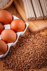 fresh natural buckwheat flour on a wooden rustic background culinary concept