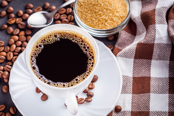 cup of fragrant fresh coffee on a dark stone background