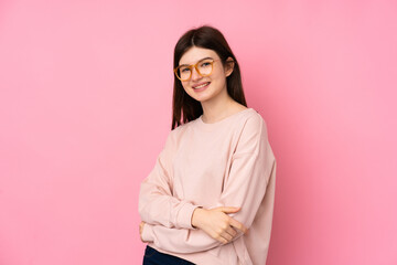 Obraz premium Young Ukrainian teenager girl over isolated pink background with glasses and happy