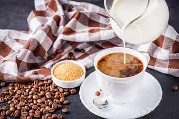 cup of fragrant fresh coffee on a dark stone background