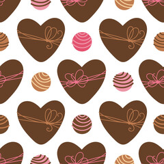 Vector seamless pattern with heart shaped box and chocolate candies. Brown color heart boxes with ribbon bow. Valentines Day background for wrapping paper, wrapper, packaging, fabric and print, etc.