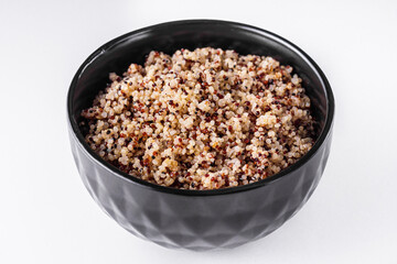 bowl of healthy quinoa on a white acrylic background