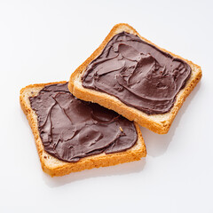 toasts with chocolate butter on a white acrylic background