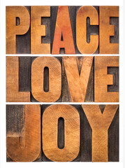 peace, love and joy typography  abstract - a collage of isolated words in letterpress wood type