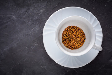 cup of instant coffee on a dark stone background