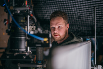 Director of photography with a camera in his hands on the set.