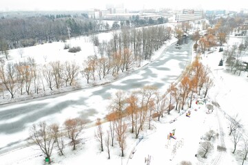 top view of the winter river that flows through the city