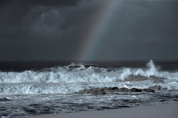 Stormy seascape with rainbow