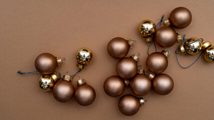 beige Christmas tree decorations on the beige table