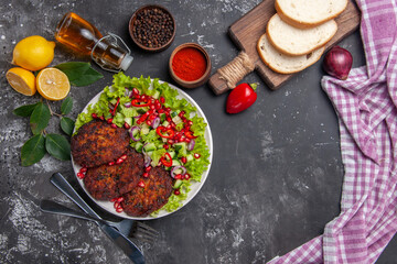 top view meat cutlets with salad and bread on grey desk food meal dish photo