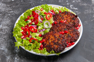 front view tasty meat cutlets with fresh salad on grey background photo dish meat food
