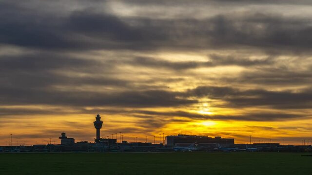 4k time lapse of a quiet Amsterdam Schiphol airport during beautiful sunset 
