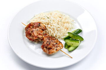 pork kebab with rice on the white plate