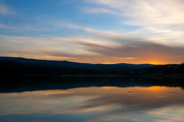 Suspension bridge in the winter mountains