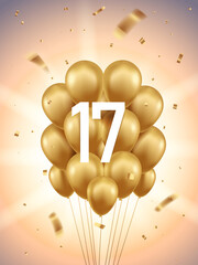 Obraz premium 17th Year anniversary celebration background. Golden balloons and confetti with sunbeams in background.