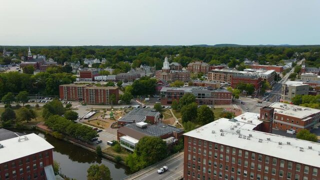 Aerial view of Cocheco Mills on Cocheco River and Dover City Hall in downtown Dover, New Hampshire NH, USA. 