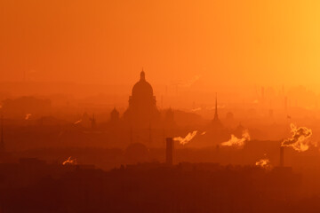 Aerial panoramic view of Saint-Petersburg, Russia, with St. Isaac's cathedral, the Winter Palace and Admiralty, with beautiful vibrant red orange sunset sundown, dusk cityscape silhouette scenery