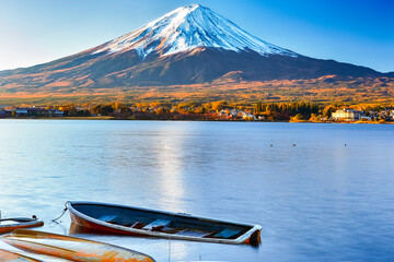 Fuji Mountain Near Lake Kawaguchiko in Japan with Line of Overthrown Boats in Foreground.
