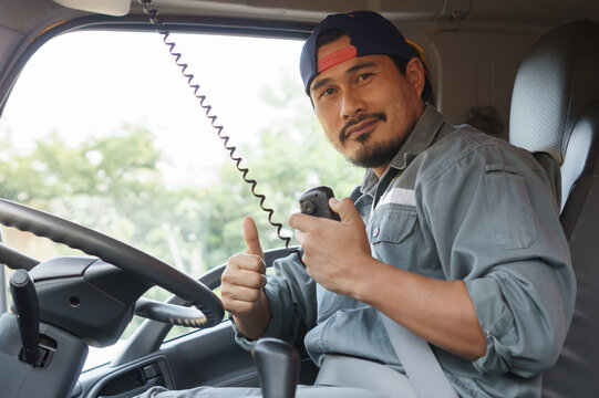 Portrait Of A Young Man Driving A Truck.