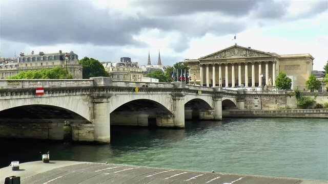 Pont de la Concorde across the Seine River and the National Assembly building in Paris, France.