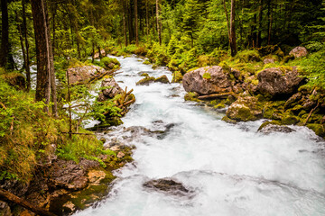Falling water in the mountains around Hallstatt, famous ancient village in Austria