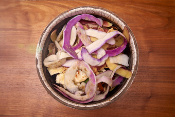 Domestic Turnip And Celery Peels In A Ceramic Pot On A Rough Wooden Table Waiting To Be Tossed In The Compost Bin