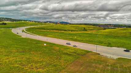 Road in the countryside, aerial view from drone on a cloudy day