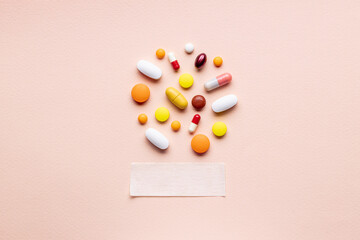 assorted medical supplies isolated on pink background. pharmacy concept. medicine conceptual. above view
