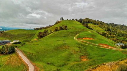 Fototapeta na wymiar Waitomo countryside and hills in spring season, aerial view of New Zealand