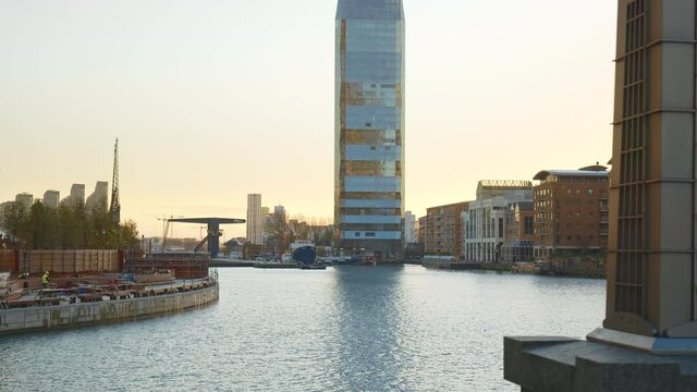 Dollar Bay Point Place residential building in Canary Wharf, London in 4K. A Crystalline Tower Skyscraper in Tower Hamlets in front of South Dock Water in E14, Isle of Dogs.