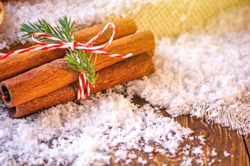 Christmas festive concept with cinnamon on a wooden surface. Selective focus, space for text