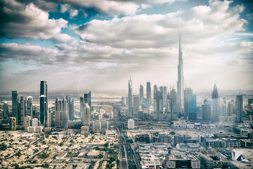 DUBAI, UAE - DECEMBER 10, 2016: Aerial view of Downtown Dubai from helicopter at sunset