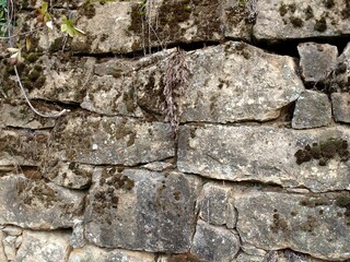 Background of the stone rock texture. Natural masonry without mortar and cement