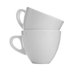 Empty clean ceramic cups on white background