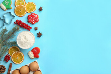 Flat lay composition with Christmas cookies and flour on light blue background. Space for text